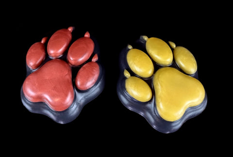 Our squishy, the Beans, by us, Vulpini Design! This big silicone paw can be ordered in custom colors and is a great squishy stress-relieving desk toy!