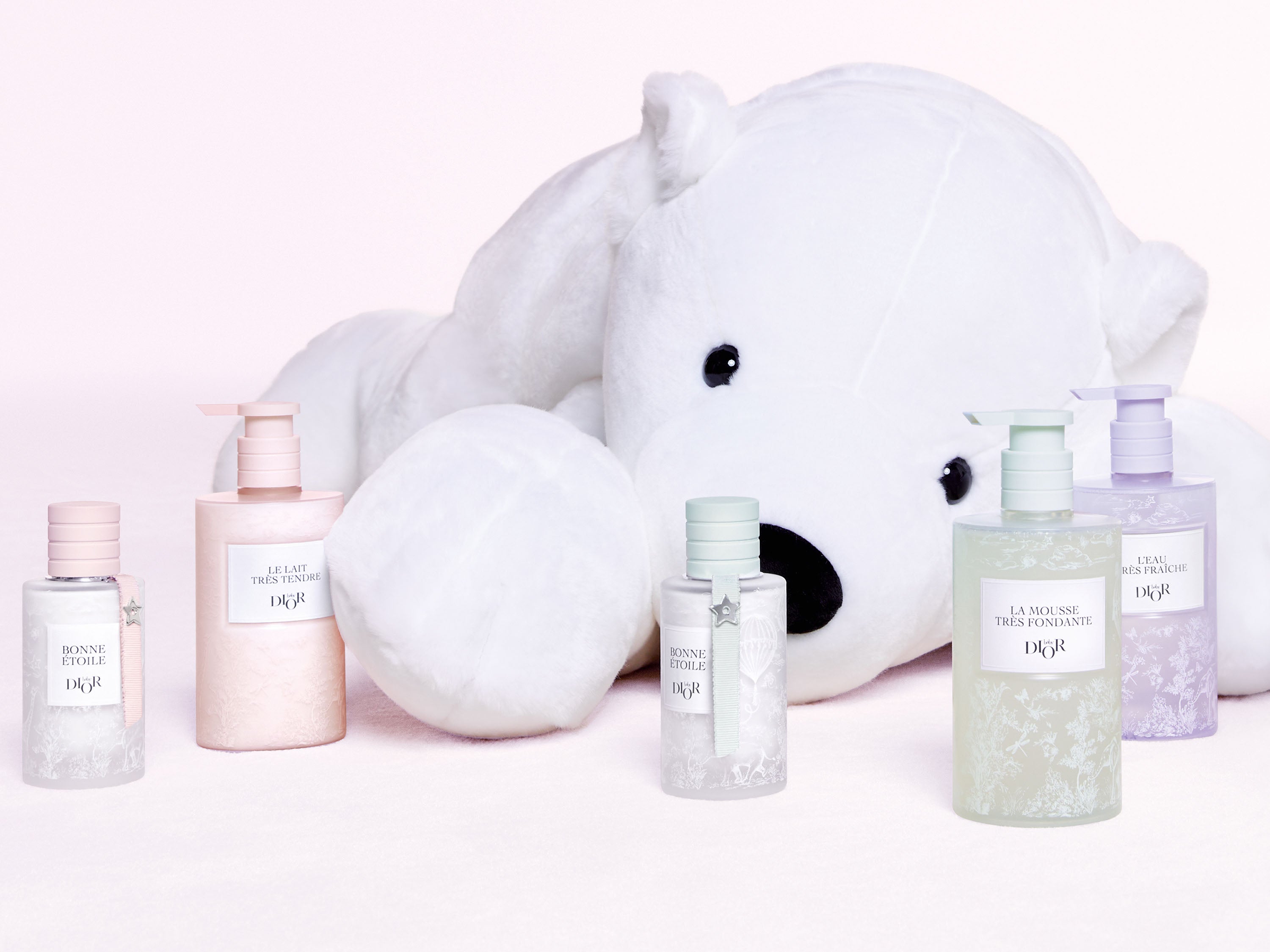 A picture of the white plush behind Baby Dior skincare products and Bonne Étoile eau de senteur.