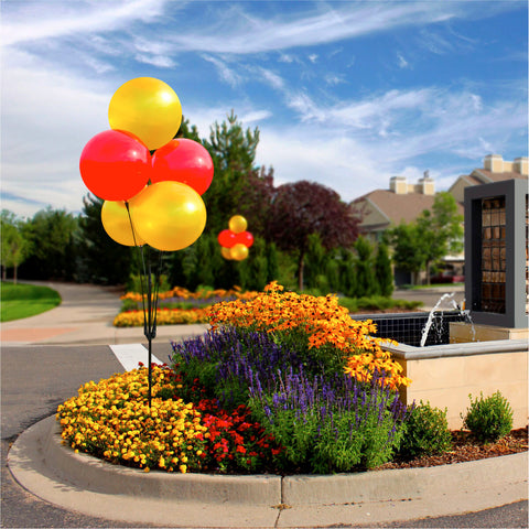 Red and yellow outdoor balloon cluster for new homes