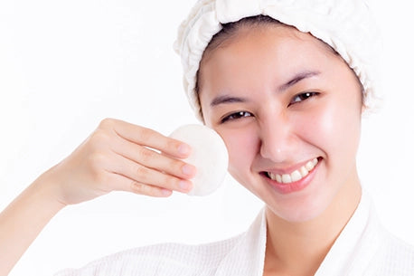 Woman picture of cleaning face with cotton pads
