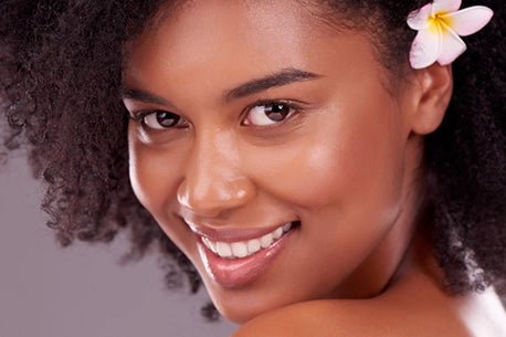 picture of girl with clear, blemish-free skin and a bright skin