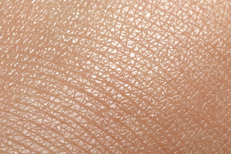 Closeup picture of dry human skin as a textured background