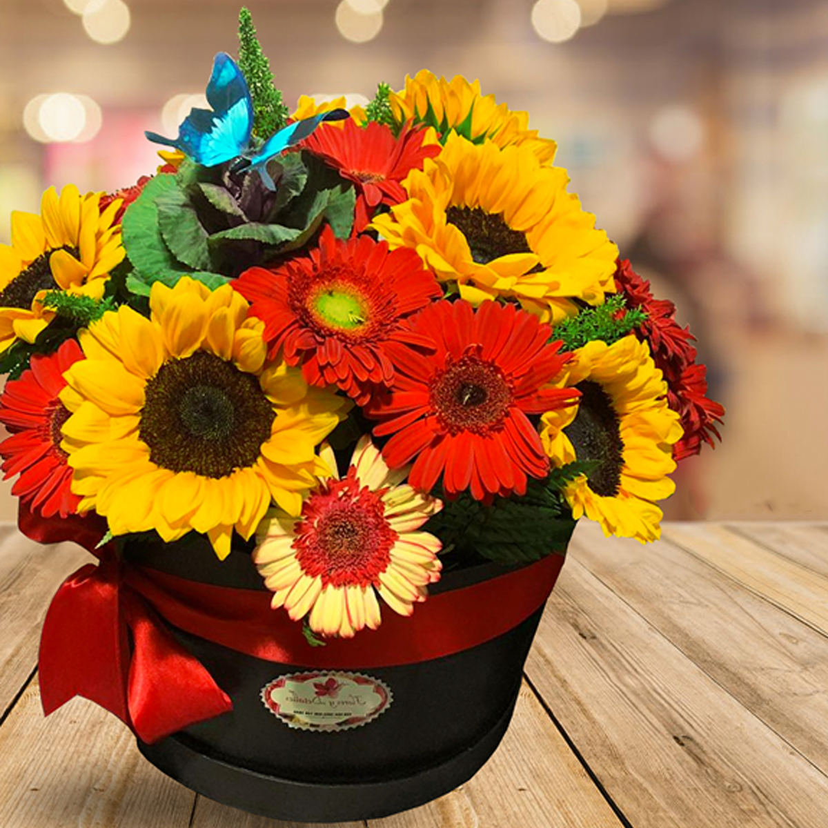 Caja cilindro con 10 girasoles y 15 gerberas – Flores y Detalles de Juárez