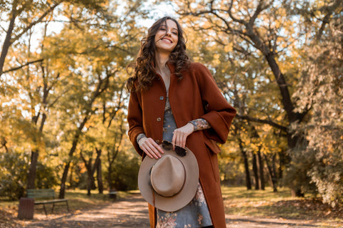 Woman wearing stylish trench coat in the fall