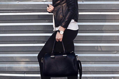 Woman wearing leggings outfit with leather jacket and accessories