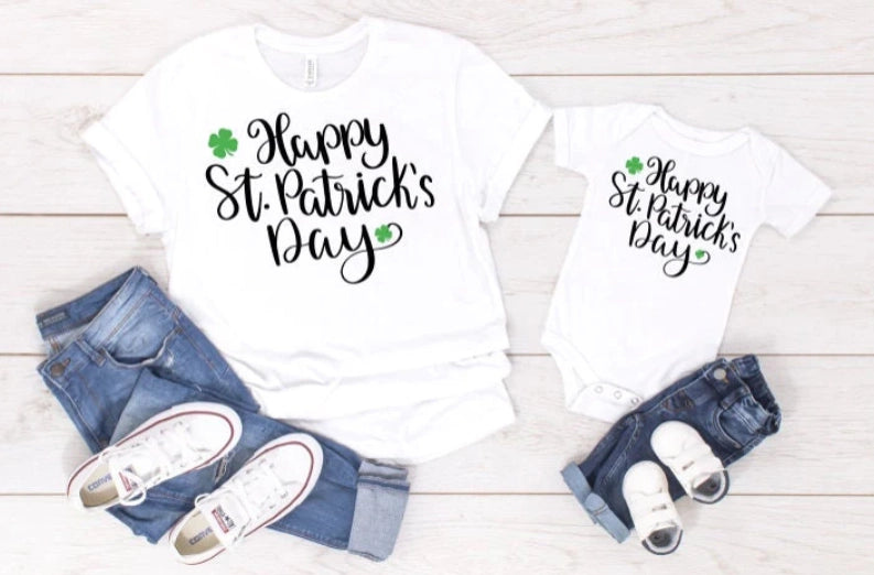 Matching St Patrick's Day shirts for mom and daughter/son. Happy St. Patrick's Day is written on the tees.