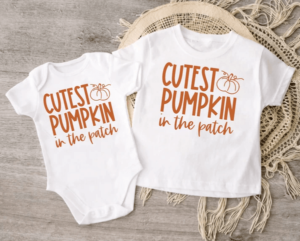 Matching Thanksgiving clothing for big sibling and little sib. Left is a bodysuit and on the right is a tee. Both say "Cutest pumpkin in the patch."