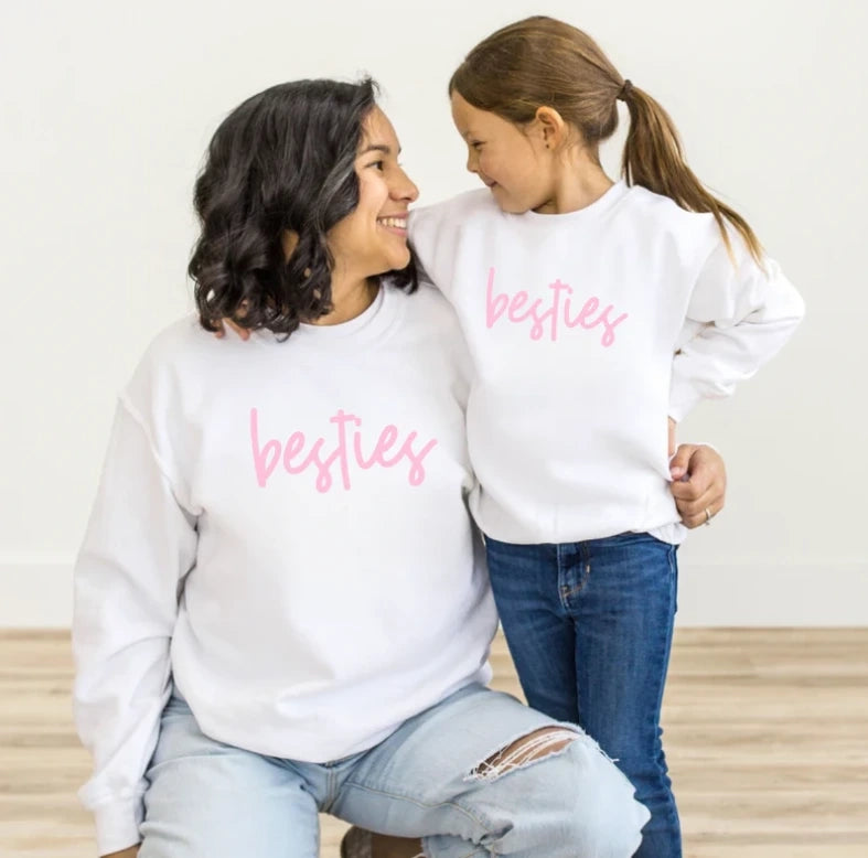 Mommy and daughter wearing matching tees and jeans