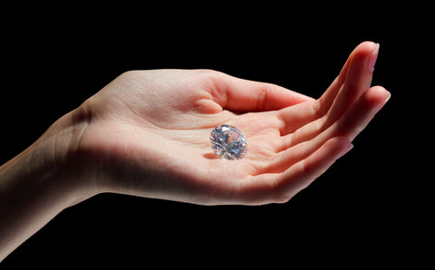 large sustainable diamond in hand
