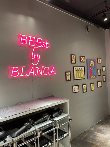 The bright pink neon lights are a perfect match for the chic interior decor.