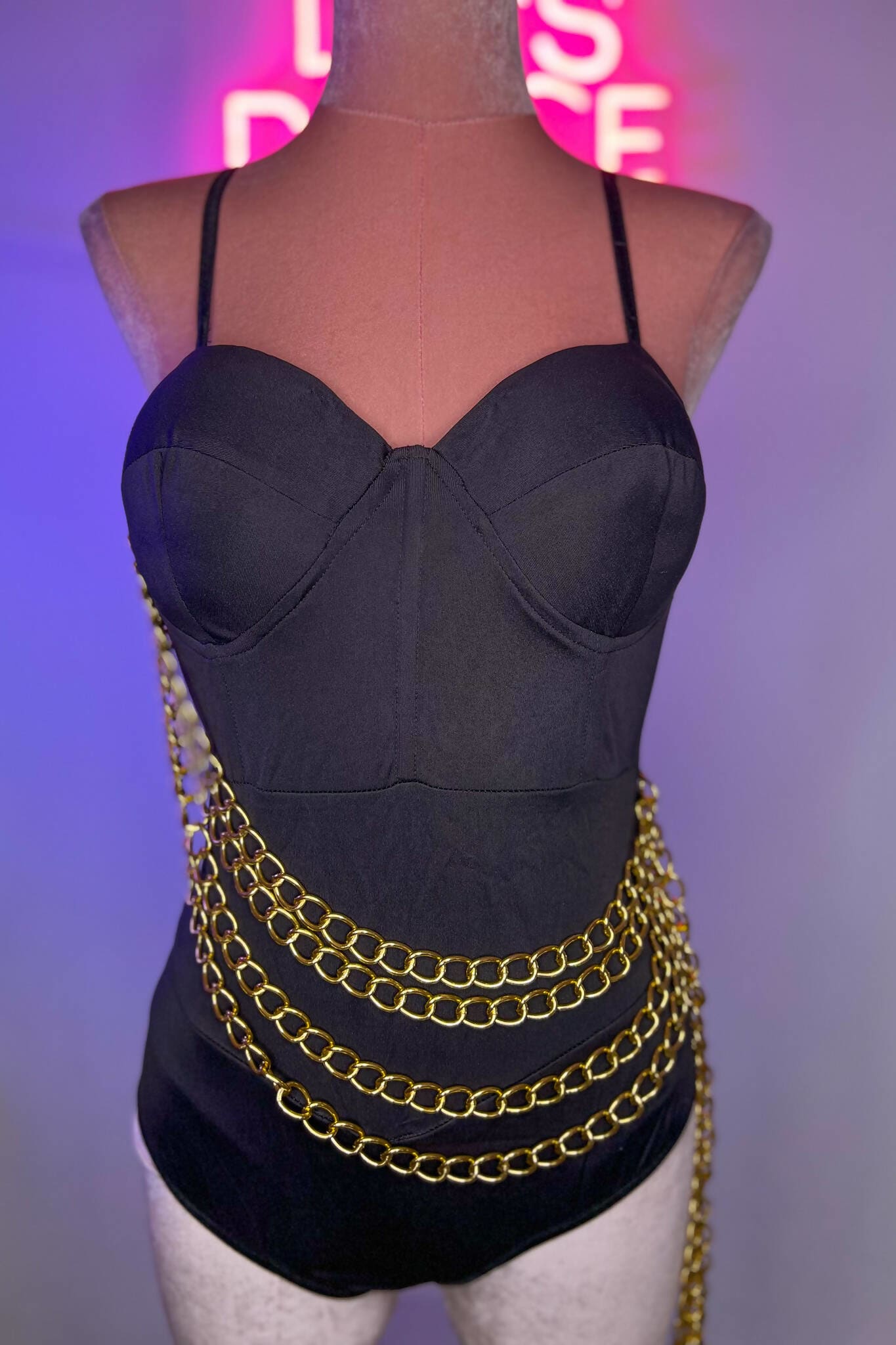 https://cdn.shopify.com/s/files/1/0569/6398/9682/products/black-corset-chain-bodysuit-a-star-is-born-wild-thing-929.jpg?v=1678463343