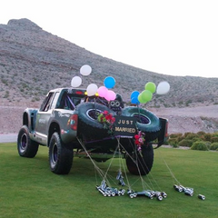 BJ Baldwin's trophy truck decorated with balloons and monster energy cans