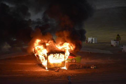 A caravan burns at War on Wheels, 2019