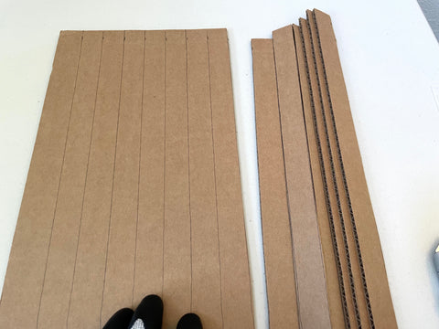 cutting strips of cardboard
