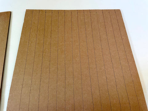 straight lines on cardboard sheet