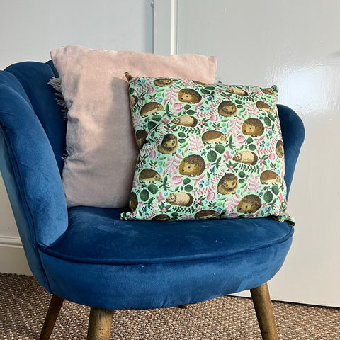 Hedgehog cushion gift sat on an armchair, armchair with a sofa cushion decorative