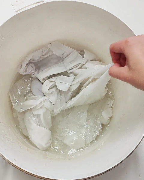 Wetting out fibers before dyeing with oak leaves