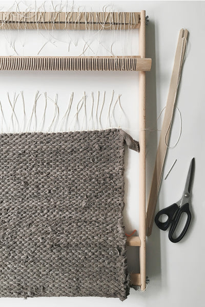weaving a rag rug on a frame loom