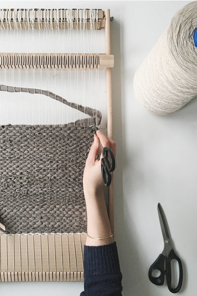 weaving a rag rug on a frame loom