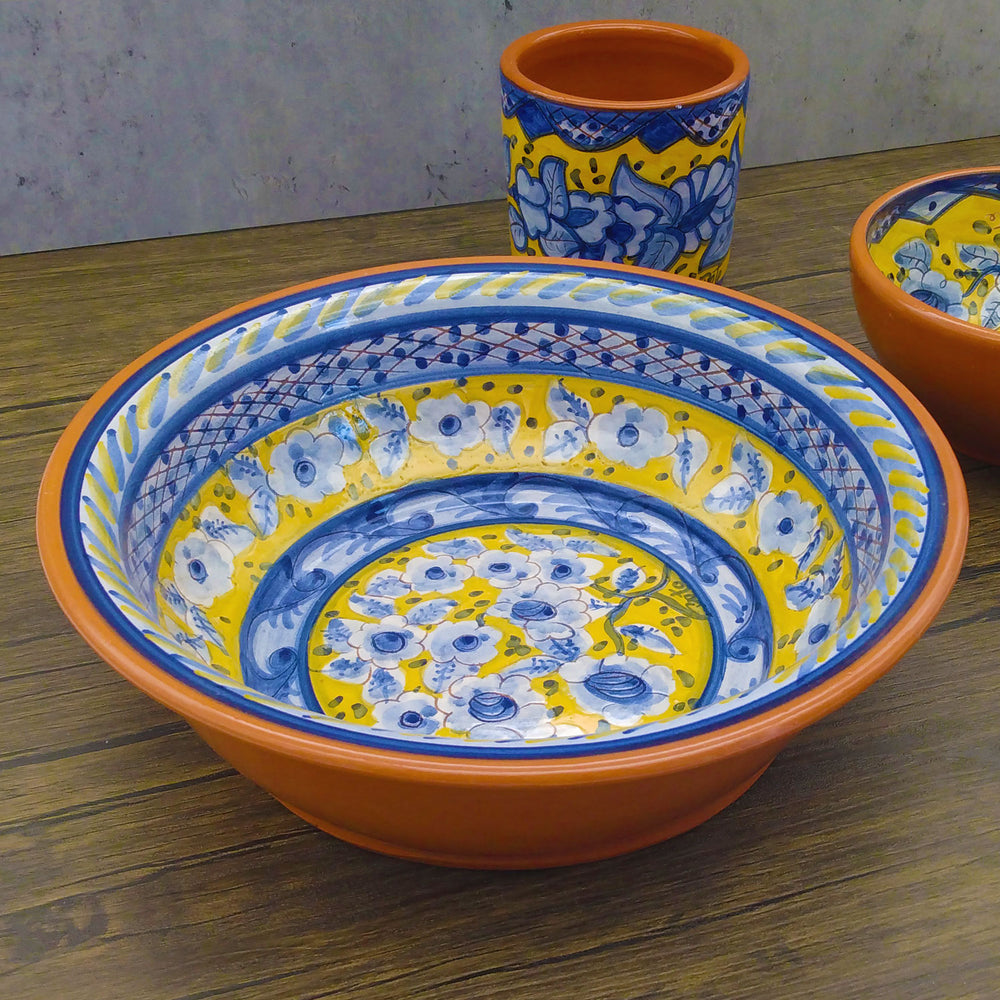 https://cdn.shopify.com/s/files/1/0569/9194/0784/products/Handmade-Hand-Painted-Portuguese-Pottery-Serving-Bowl-Yellow_4.jpg?v=1647983434&width=1000