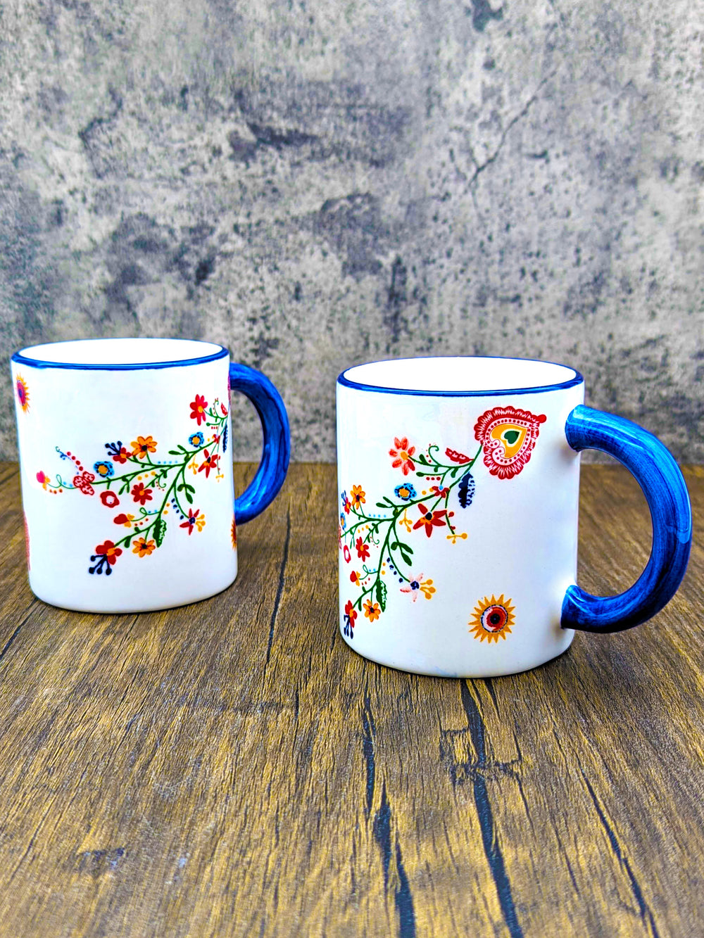 https://cdn.shopify.com/s/files/1/0569/9194/0784/products/Portuguese-Pottery-Alcobaca-Ceramic-Coffee-Mug-Floral-Set-of-2_5.jpg?v=1672336287&width=1000