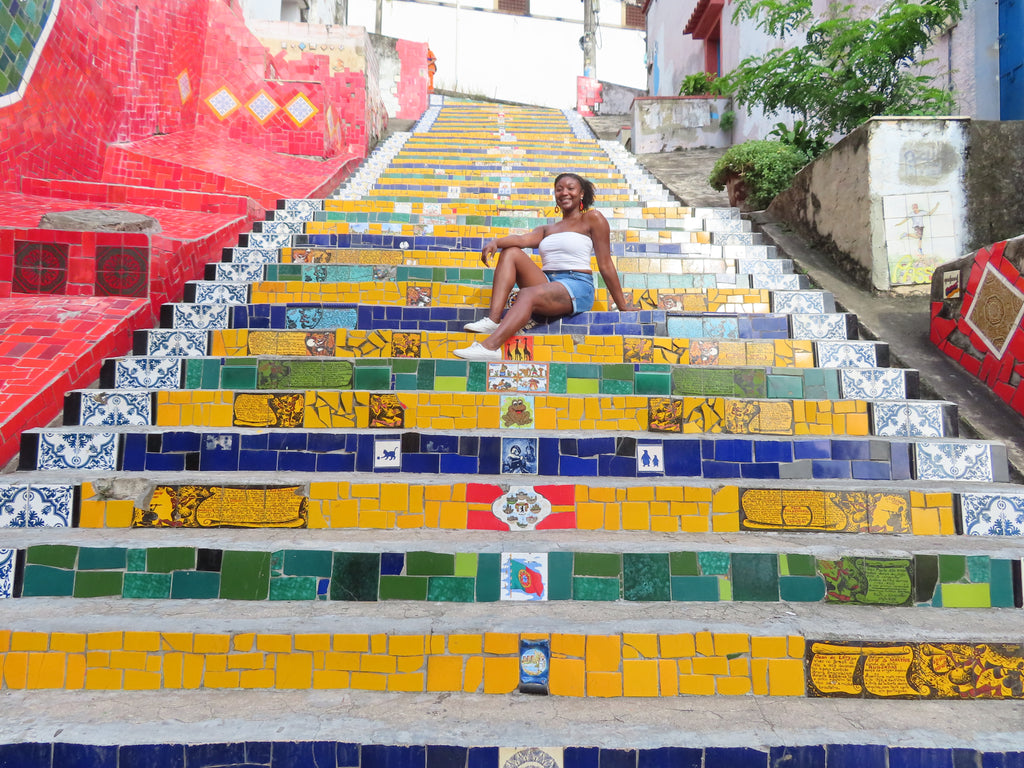Solo travel girl sitting on the Lapa Steps in Rio Janeiro Brazil