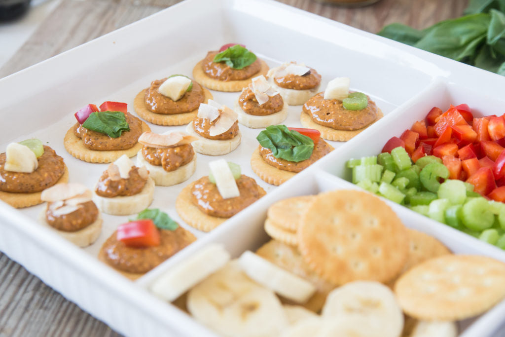 crackers and banana with nut butter and toppings