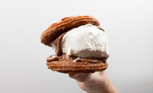 A churros ice cream sandwich made with El Rico Chocolate Peanut Butter