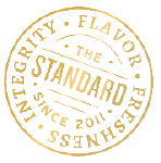 stamp of icon that says'the standard since 2011 - integrity - flavor - freshness'