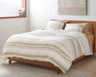 Lobos organic cotton duvet cover with yarn dyed stripes of small geometric patterns. Soft white with hazel. From Coyuchi.