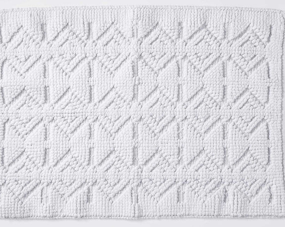 This bath rug is made from organic cotton and displays the subtle wonder of mineral tones.