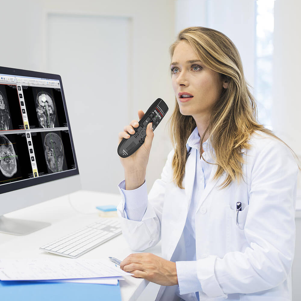 A radiologist is using a Philips SMP4000 SpeechMike Premium.