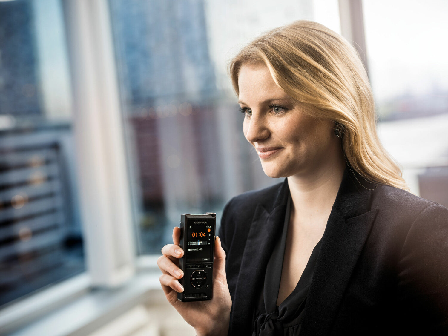 female lawyer holding olympus ds9000