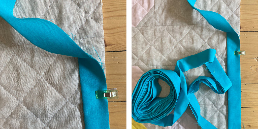 Using a clip to pin the binding to the quilt and leaving a long tail for joining ends later.