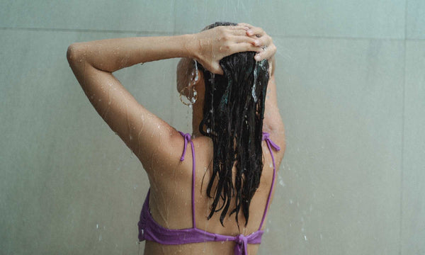 girl in shower washing hair