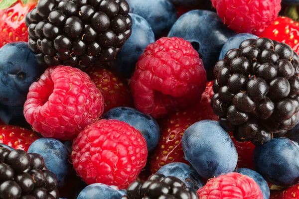 up close shot of a collection of raspberries, blackberries and blueberries
