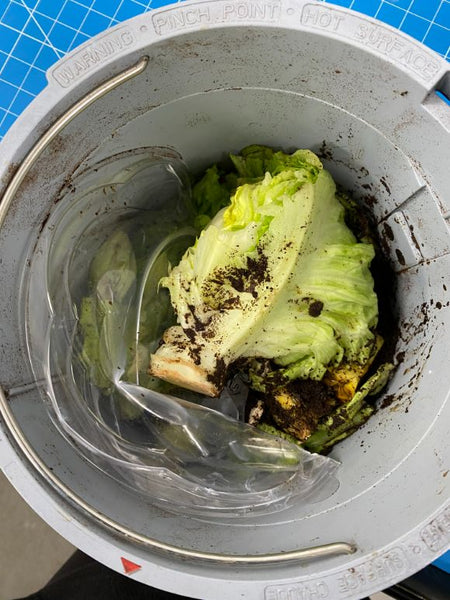 An image of Eco Products Large Salad Bowl PLA Lid and food waste in lomi