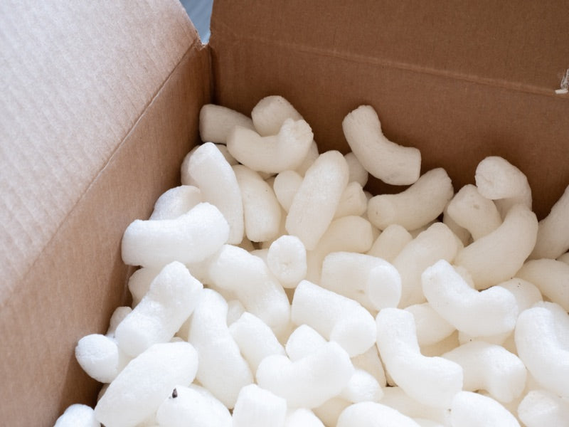 A cardboard box of biodegradable packing peanuts