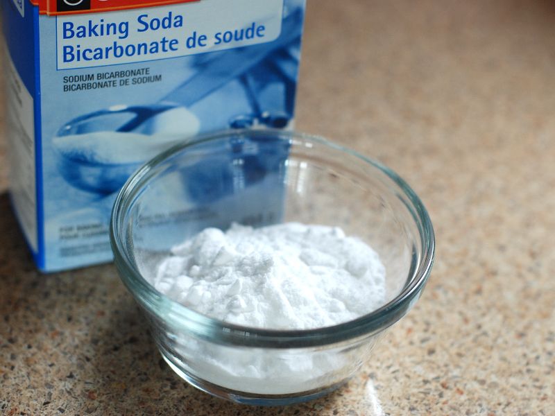 A box and small bowl filled with baking soda