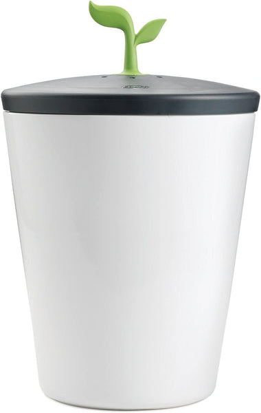 white food waste caddy with green leaf