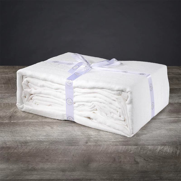 A folded set of luxury bed sheets