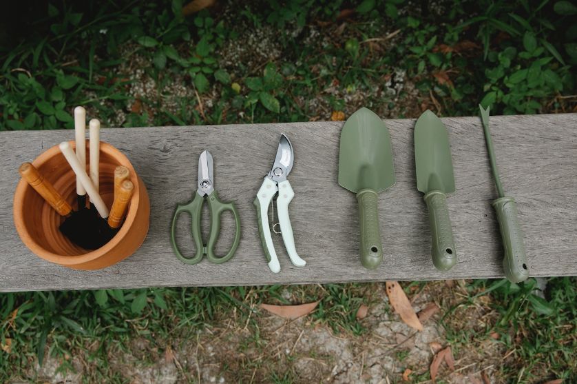 Row of green garden tools