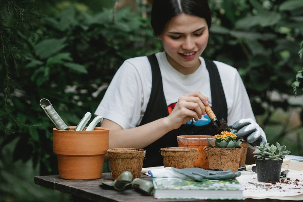 Young woman planting flower seeds