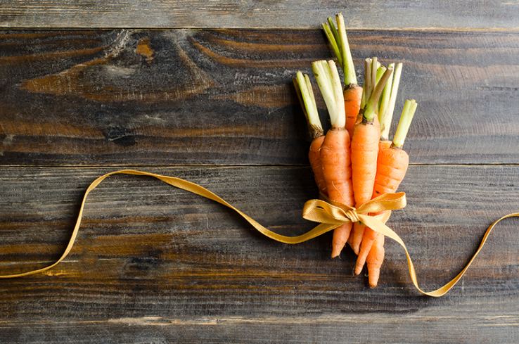 A bundle of carrots wrapped in a ribbon