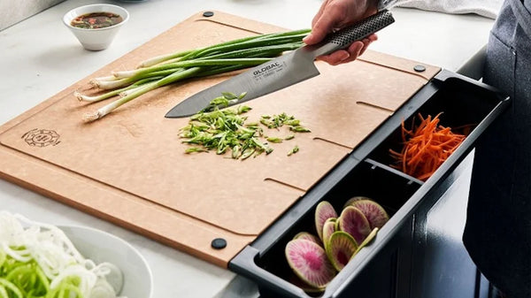 bamboo cutting board with 3 drawers filled with veggies