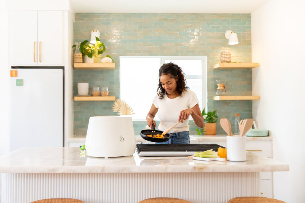 Grandma and kids with lomi composter in kitchen