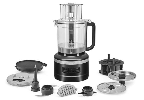 Simple product image of the food processor and dicer displayed with all of its attachments spread out around its base