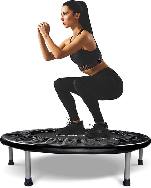 Woman jumping on mini trampoline