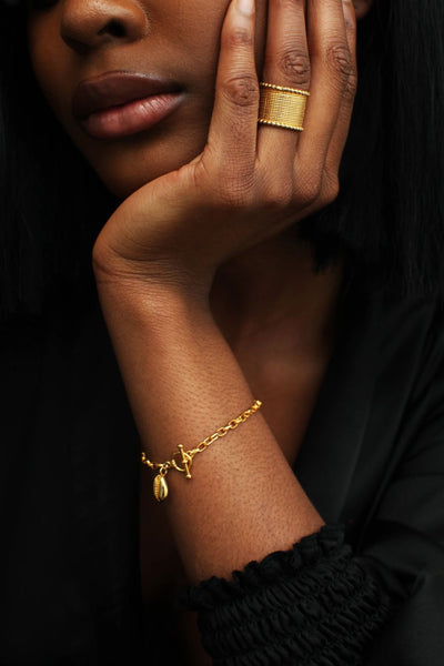 Woman wearing beautiful golden omiwoods bracelet