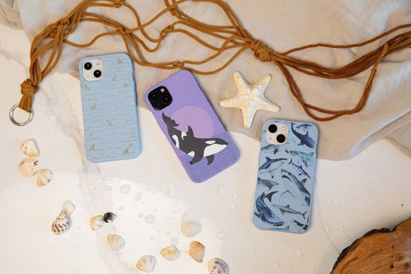 Three Pela cases displayed on a beach themed background